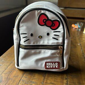 Hello Kitty mini backpack  Faux leather  shaped as Hello Kittys face  front zipp